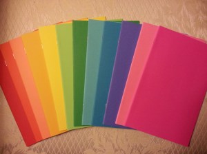 {a rainbow of blank books}
